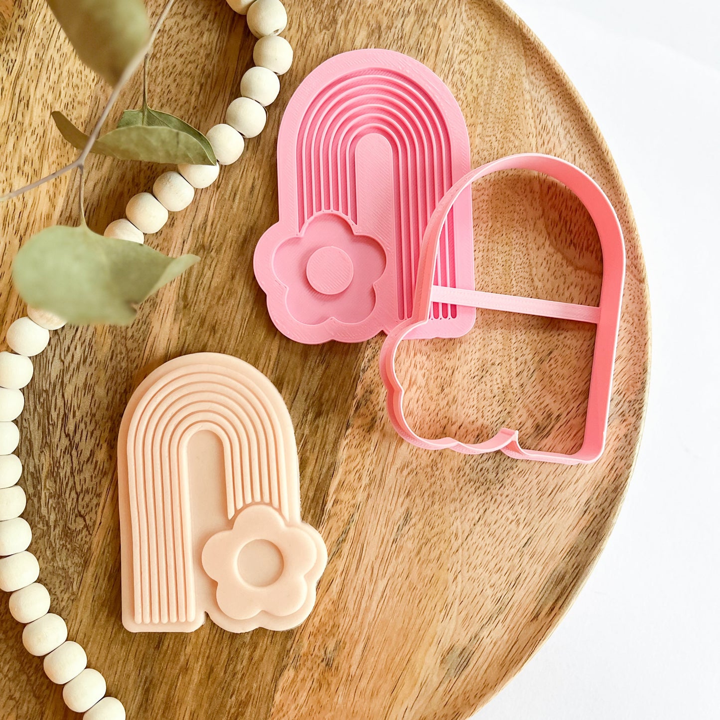 Rainbow cookie cutter with flower detail, great for pastel cookie decorating at baby showers and springtime events.