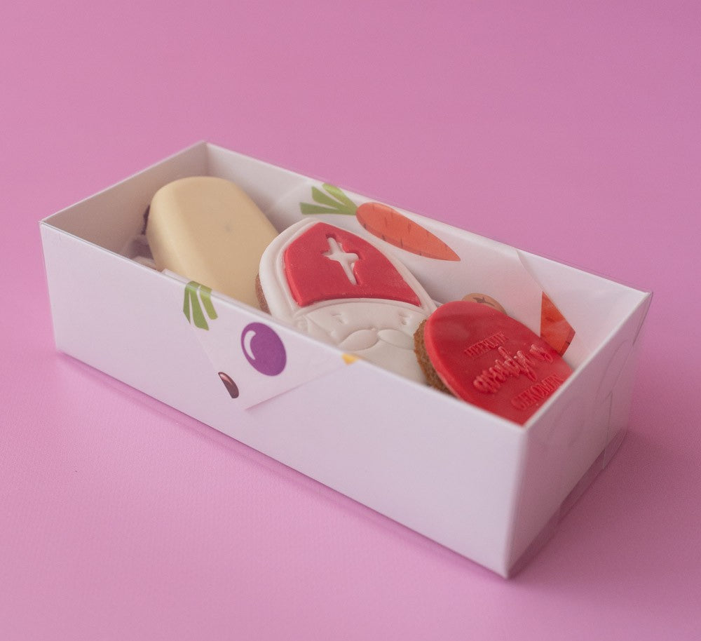 Set of colorful soap bars in a box on a pink background