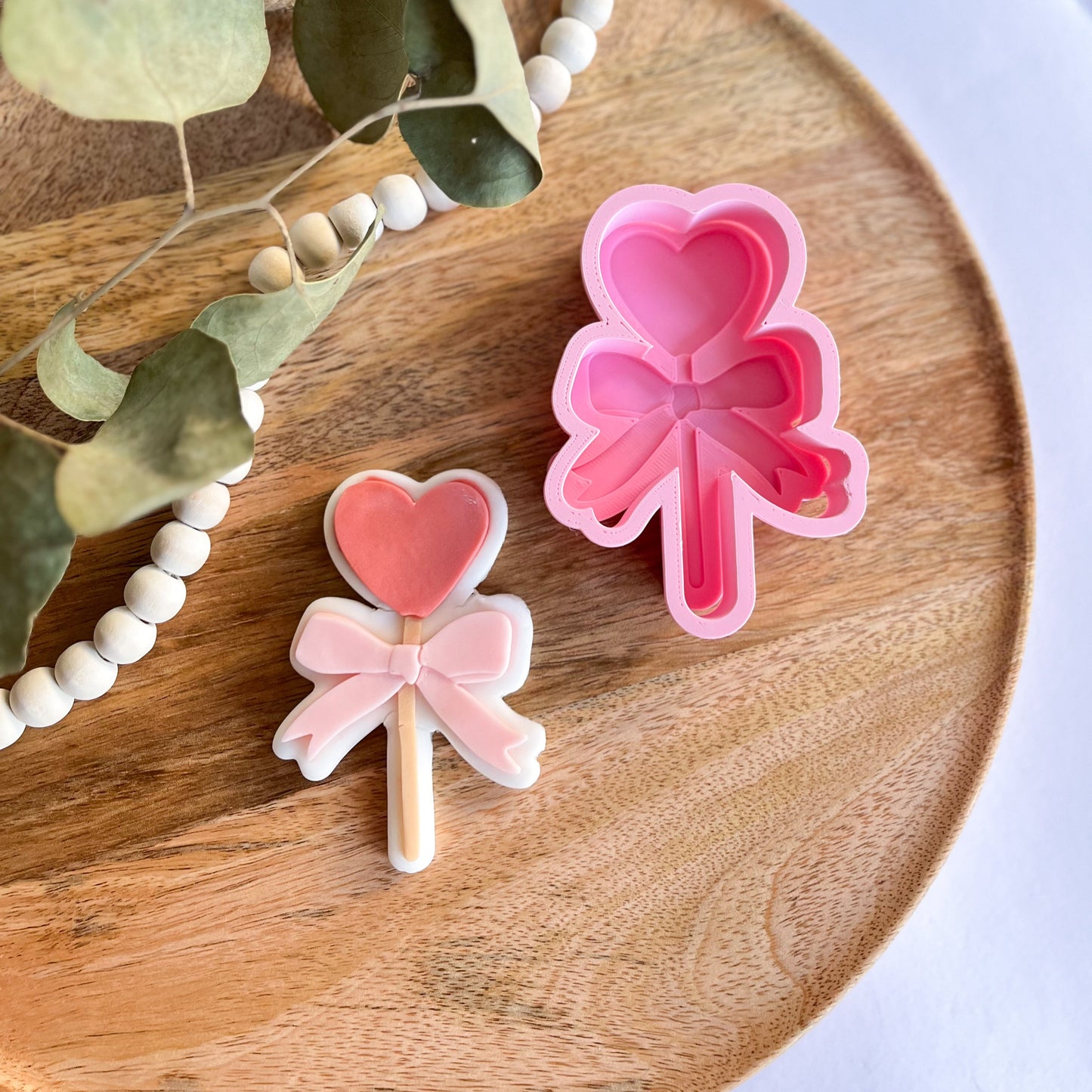 Heart bow lollipop embossed cookie cutter – an adorable design for Valentine's Day and party cookies.