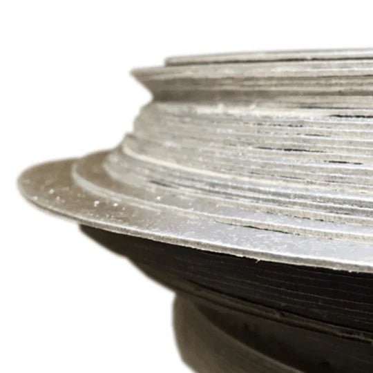 Close-up of a spool of silver wire on a white background
