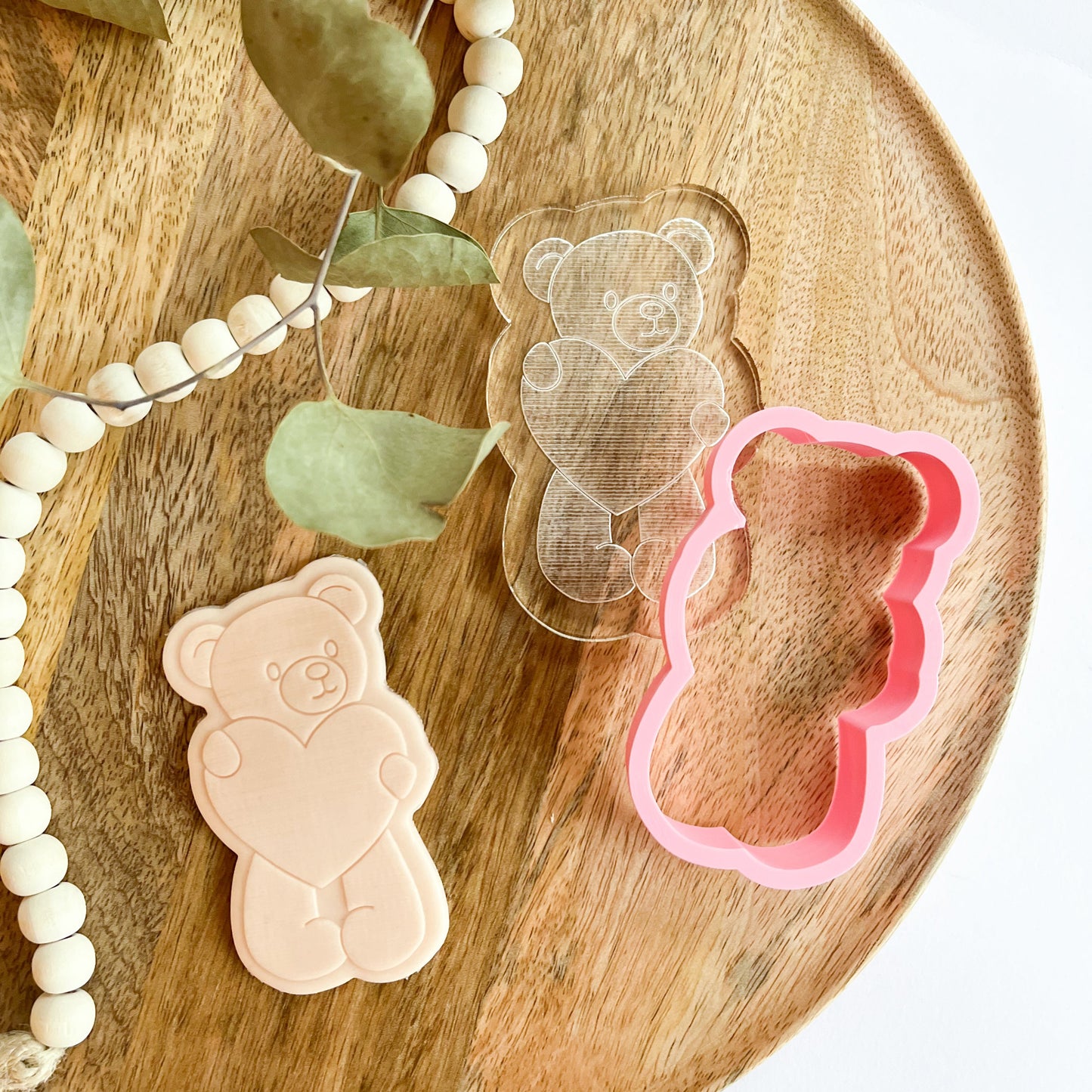 Teddy bear cookie cutter holding a heart, perfect for decorating sweet Valentine’s, birthday, or baby shower cookies.