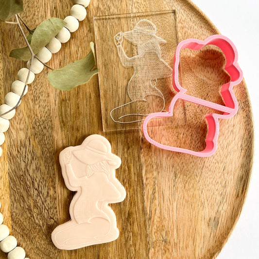 ALT Text:
Pregnant woman silhouette cookie cutter and embosser, ideal for baby showers and maternity-themed cookie decorations.