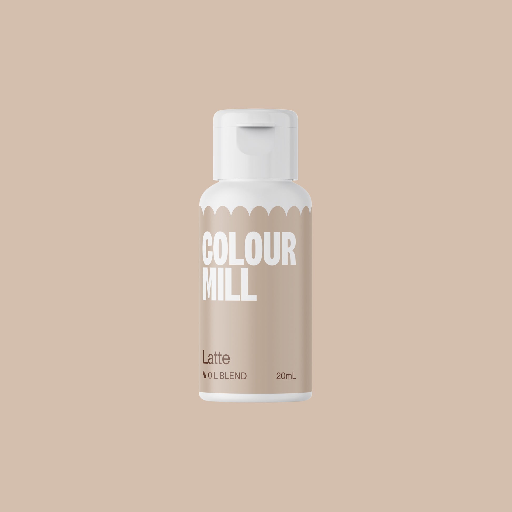 Bottle of Colour Mill Latte oil blend on a beige background