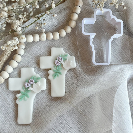 Elegant cross cookie cutter with leaf detail embosser for Easter, confirmations, and religious celebrations.