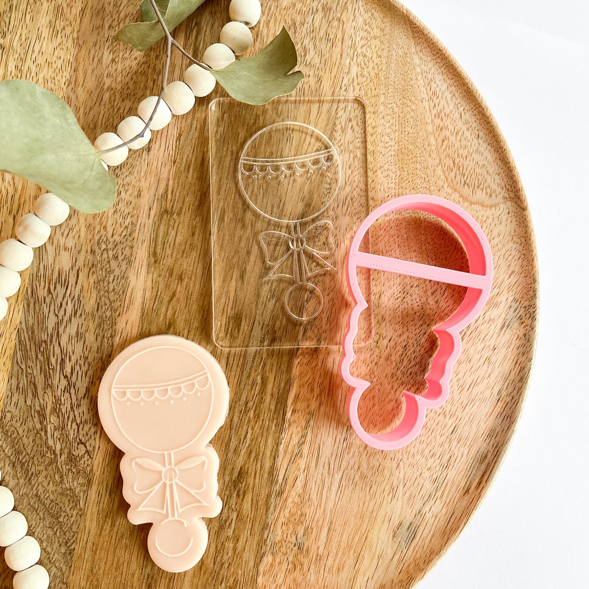 Baby rattle cookie cutter and acrylic stamp set for baby showers and gender reveal party cookies. Includes embosser for fondant or dough.