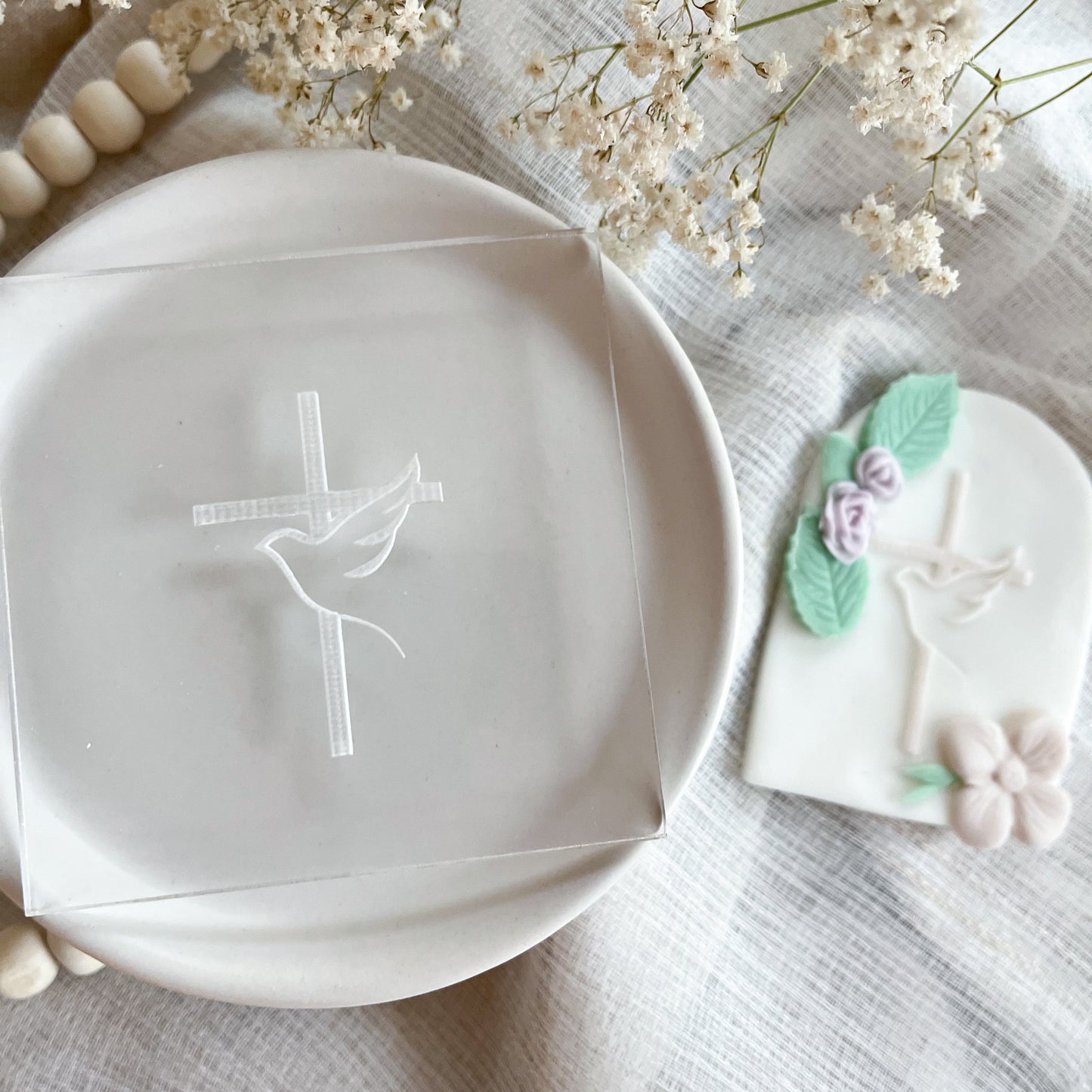 Vertical cookie embosser with dove and cross design for spiritual events and religious cookies.