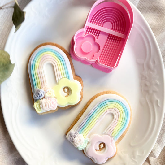 Rainbow cookie cutter with flower detail, great for pastel cookie decorating at baby showers and springtime events.