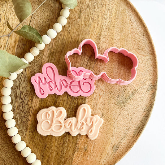 Script-style "Baby" cookie cutter with matching embosser, perfect for decorating baby shower or newborn cookies.