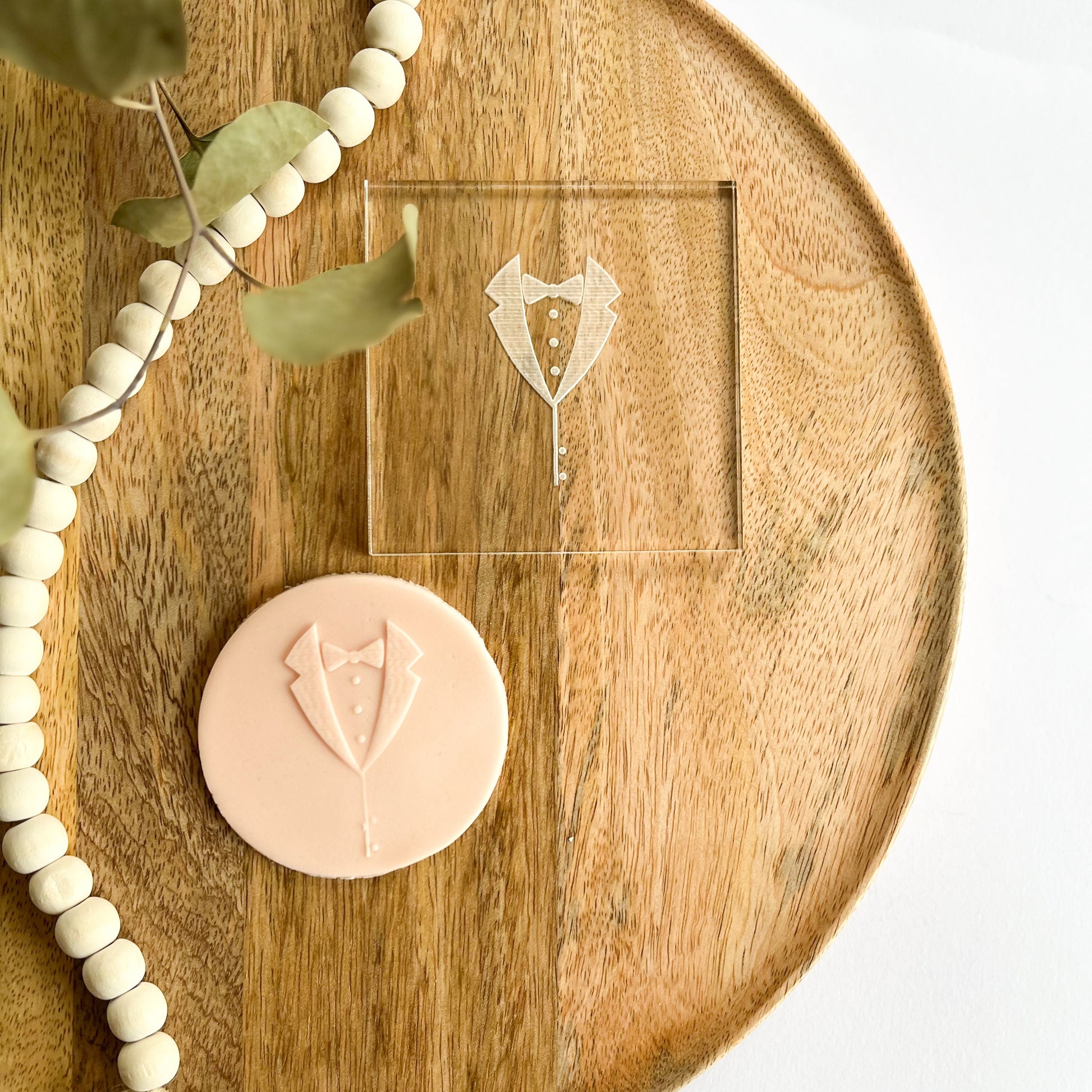 Tuxedo cookie embosser with bow tie and jacket design, ideal for groom-themed wedding cookies and formal event baking.