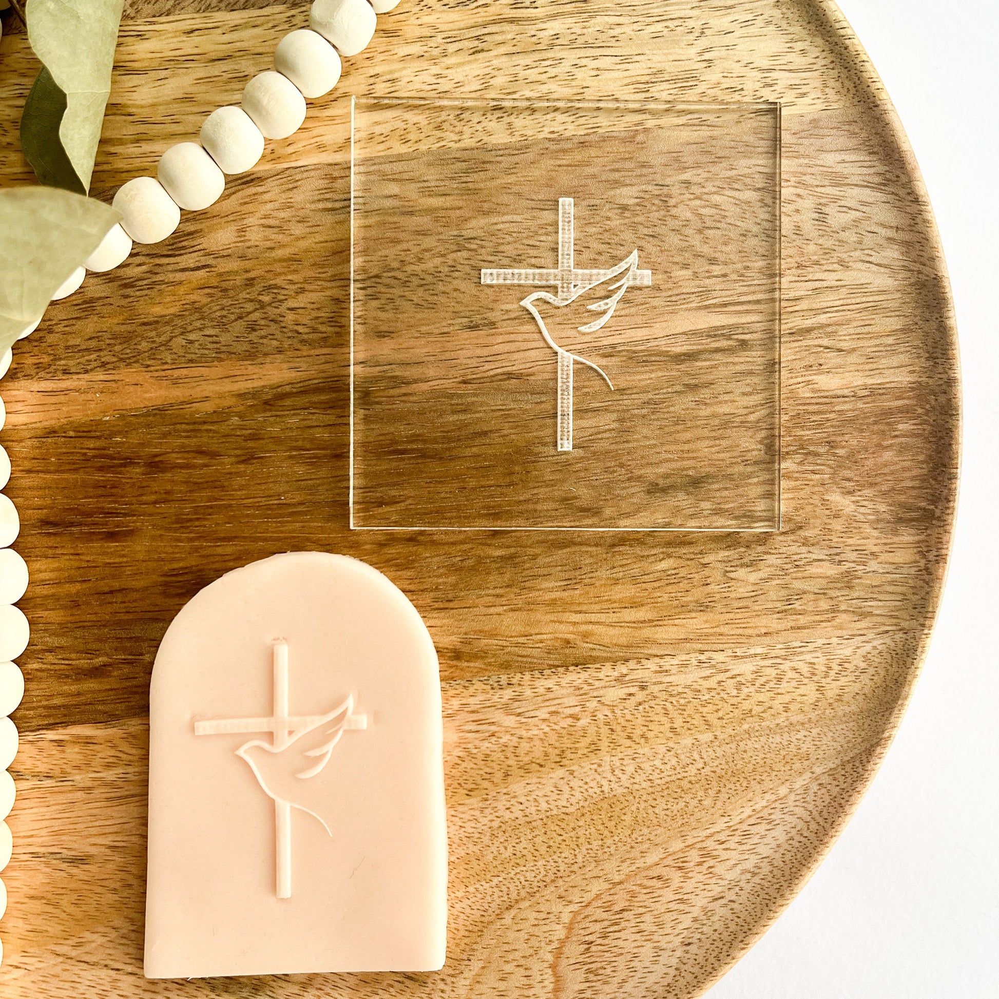 Vertical cookie embosser with dove and cross design for spiritual events and religious cookies.