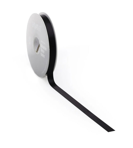 Roll of black ribbon on a white background