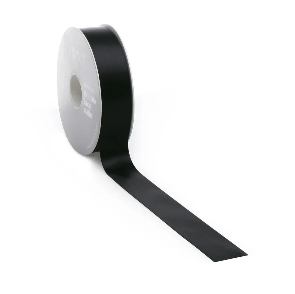 Roll of black ribbon on a white background
