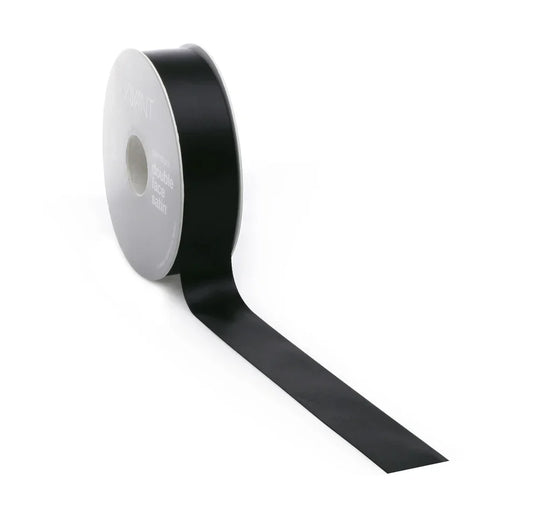 Roll of black ribbon on a white background