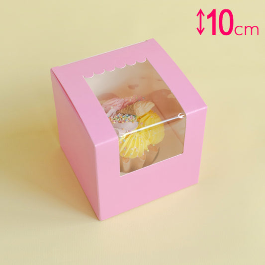Pink box with a clear window showing pastries, on a light yellow background.