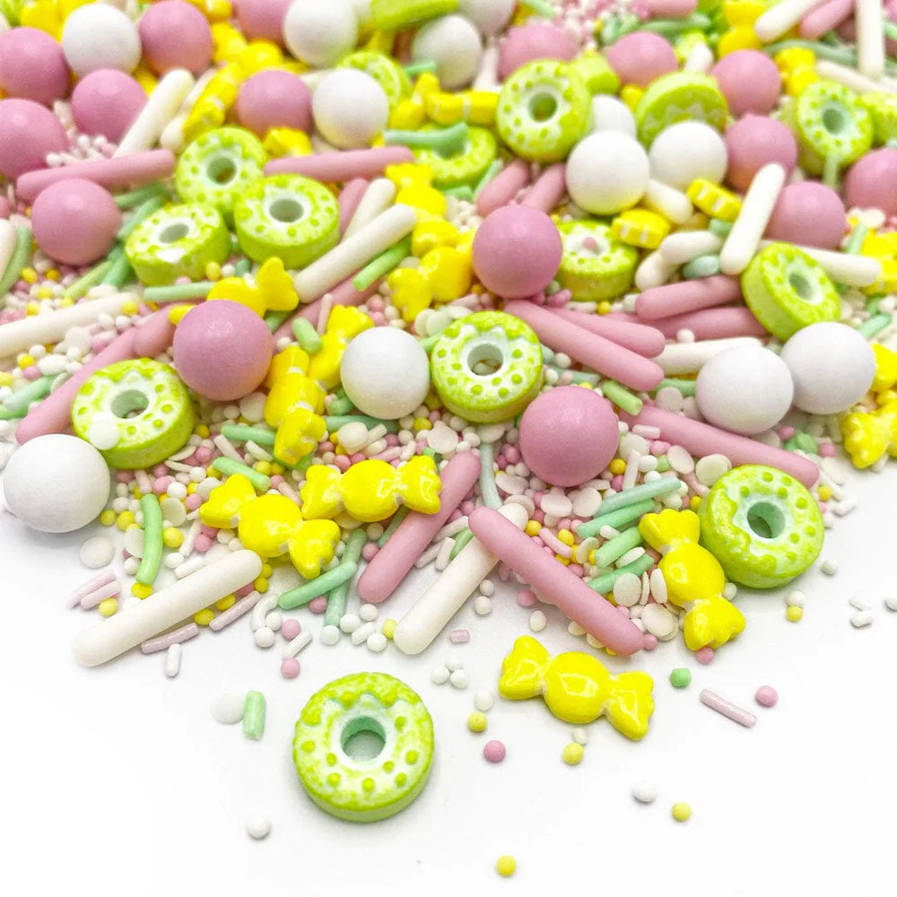 Donut Worry sprinkle mix – fun pink, white, and brown sprinkles perfect for donut-themed cakes and treats.